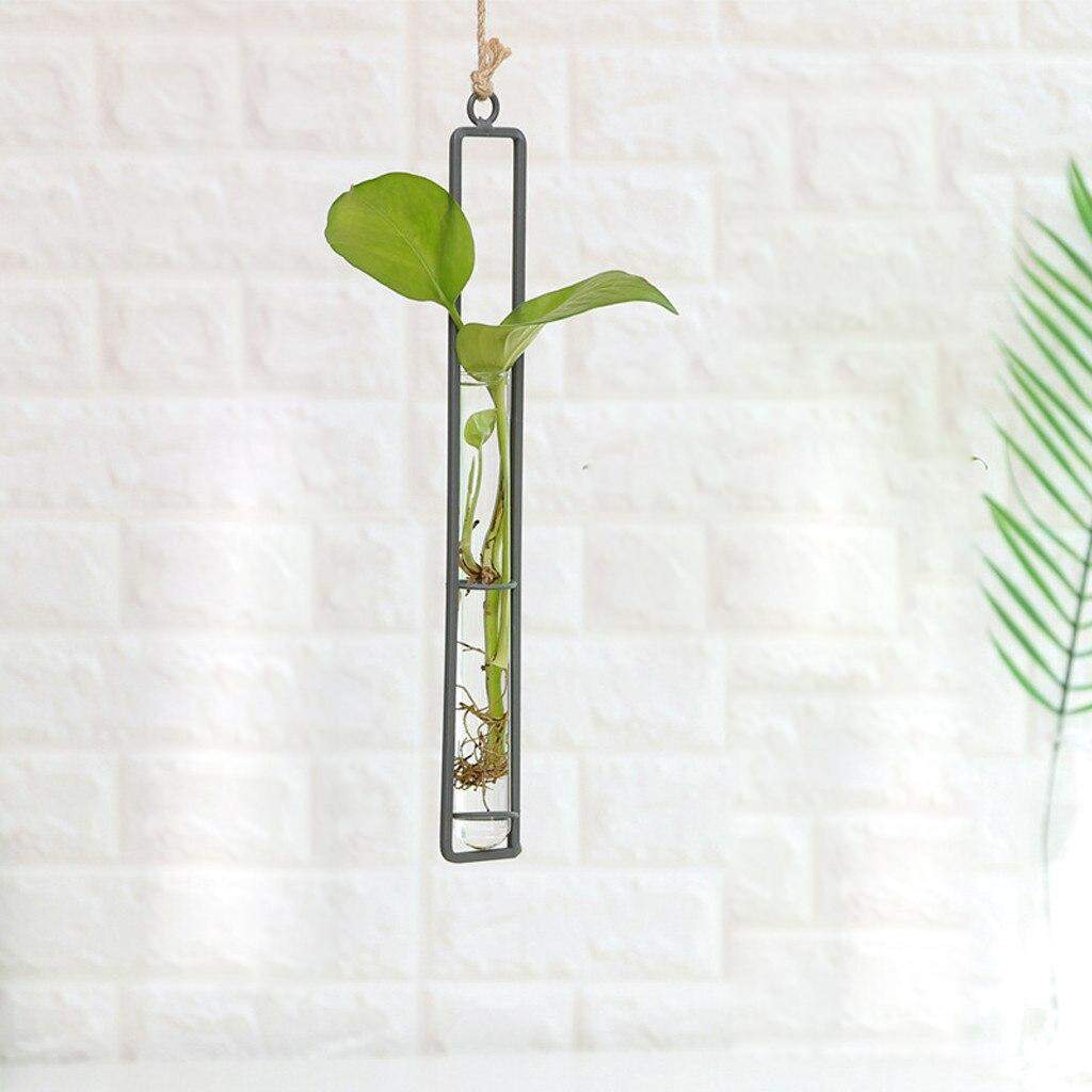 Hængende glasvase med stålramme