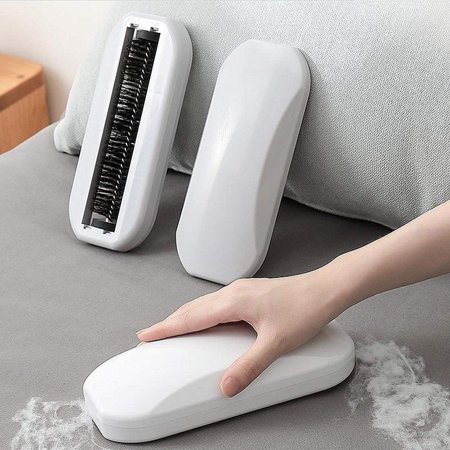 Smudsopsamlende møbelbørste